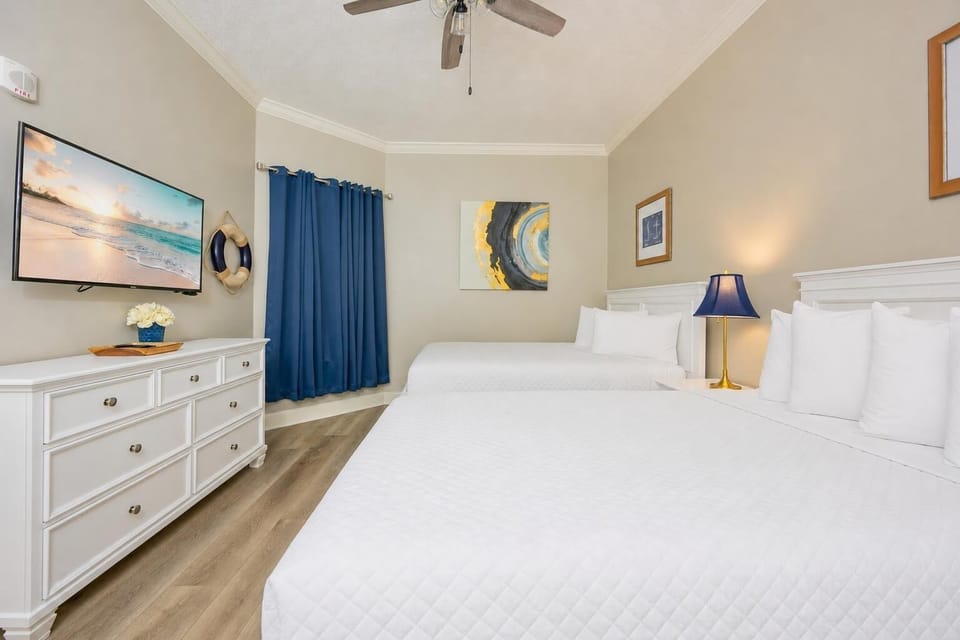 Unwind in this queen guest suite and stream your favorite shows or enjoy a good movie after a beach day