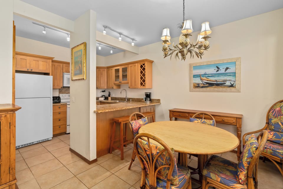 Gather around this welcoming dining space where your group can share meals and stories. The open layout connects seamlessly to a fully equipped kitchen, making meal prep and entertaining a breeze.