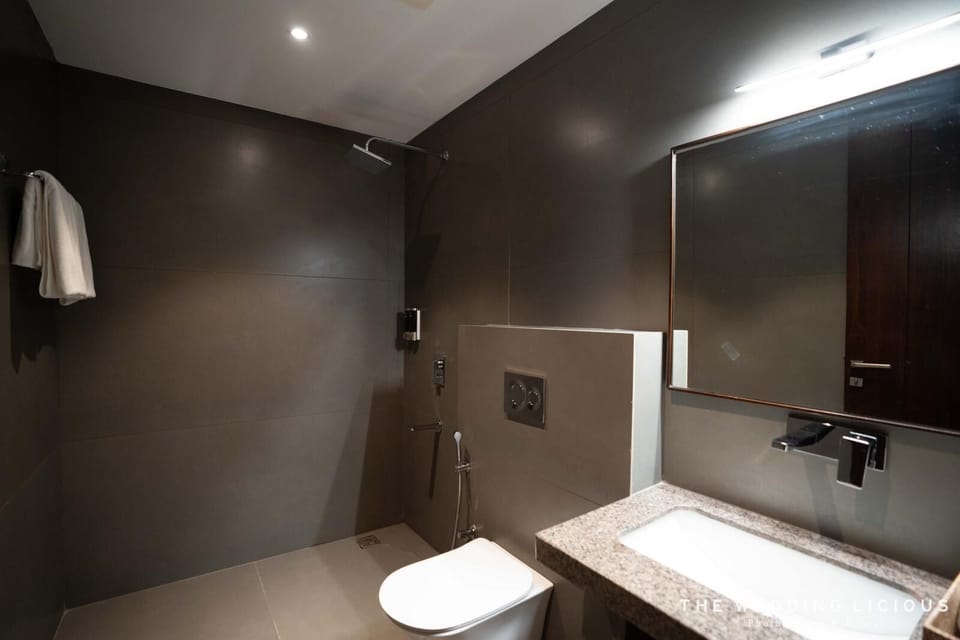 Luxury Suite, Balcony, City View | Bathroom | Hair dryer, slippers, towels, soap