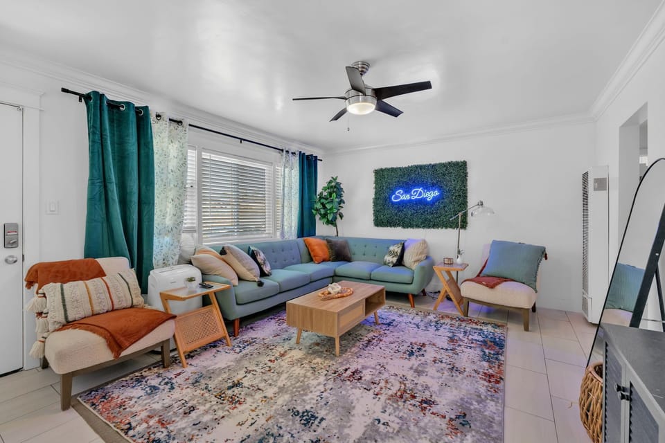 A cozy living room with blue accents, stylish couches, and elegant decor.