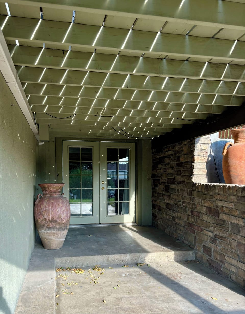 French doors under the deck leading to theater room