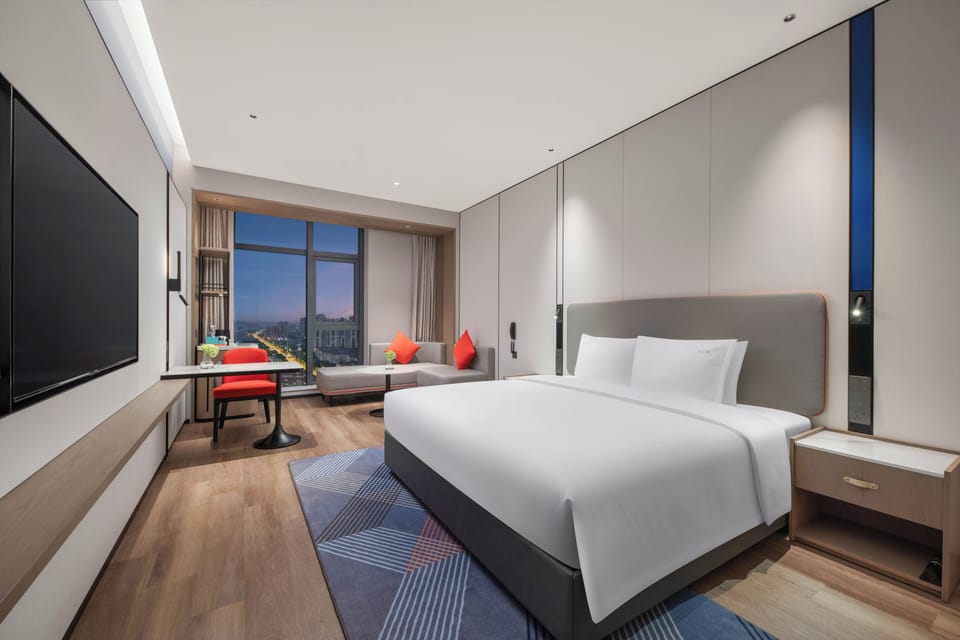 Premium bedding, down comforters, laptop workspace, blackout drapes