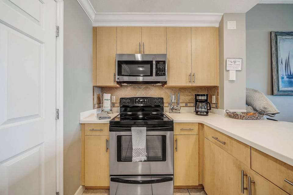The fully equipped kitchen features stainless-steel appliances, pantry, and has everything you need to prepare meals for family and friends.