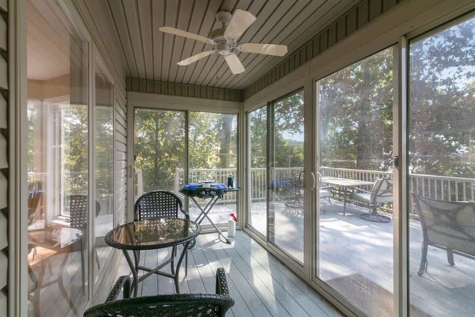 Lake-view sunroom perfect for lounging