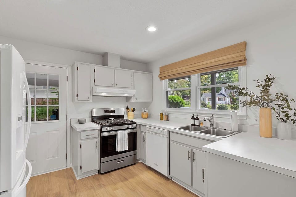 The kitchen is equipped with a double sink