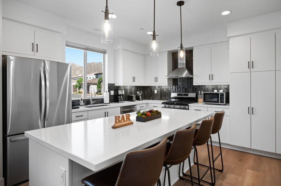A sleek kitchen with a spacious island