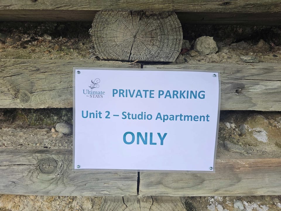 Parking is available for your vehicle along the retaining wall in the driveway