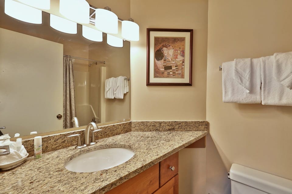 Set out your toiletries beside the sink, with a wide mirror above the vanity.