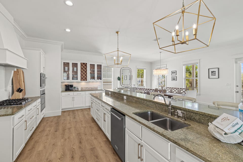 Your spacious chef's kitchen awaits with gleaming granite counters, modern appliances, and elegant pendant lighting for memorable meal prep.