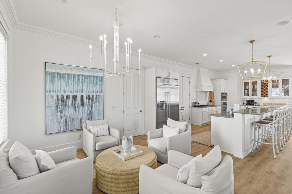 Sink into plush seating in your elegant living room, where soft textures and warm lighting create the perfect atmosphere for relaxation and conversation.