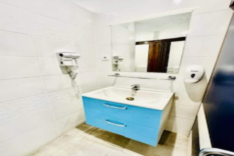 Shower, hair dryer, soap, shampoo
