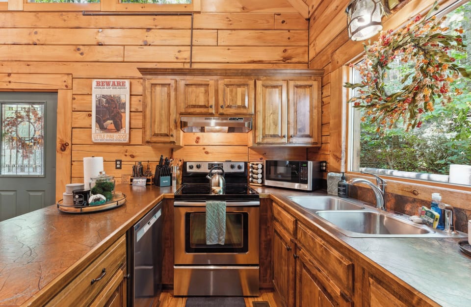 Fully stocked kitchen with large picture window overlooking the bear trail