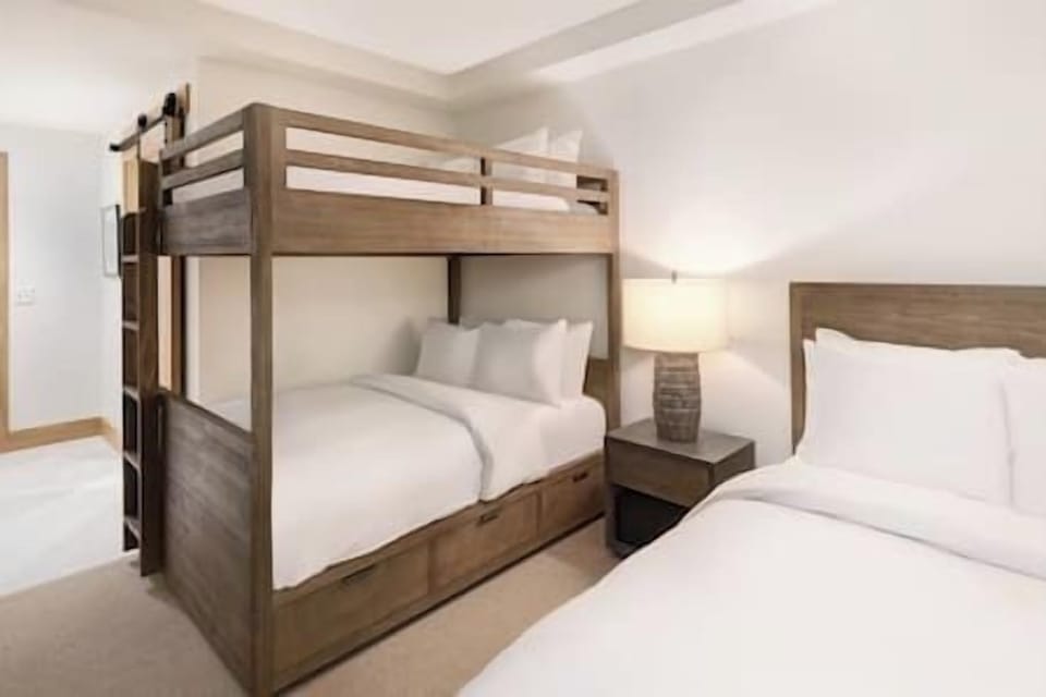 Settle in together with cozy bunks and crisp linens.
