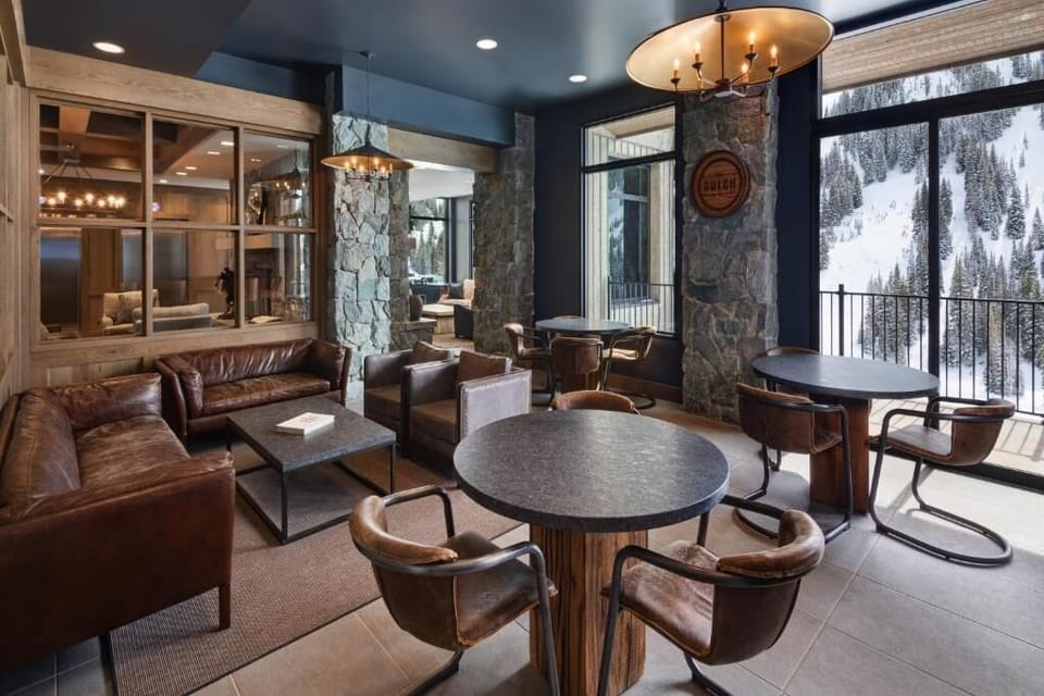 Gather by cozy seating and savor views through tall windows.