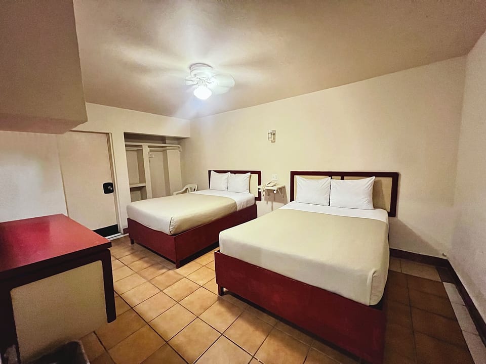 Double Room, 2 Double Beds | Desk, laptop workspace, blackout drapes, iron/ironing board