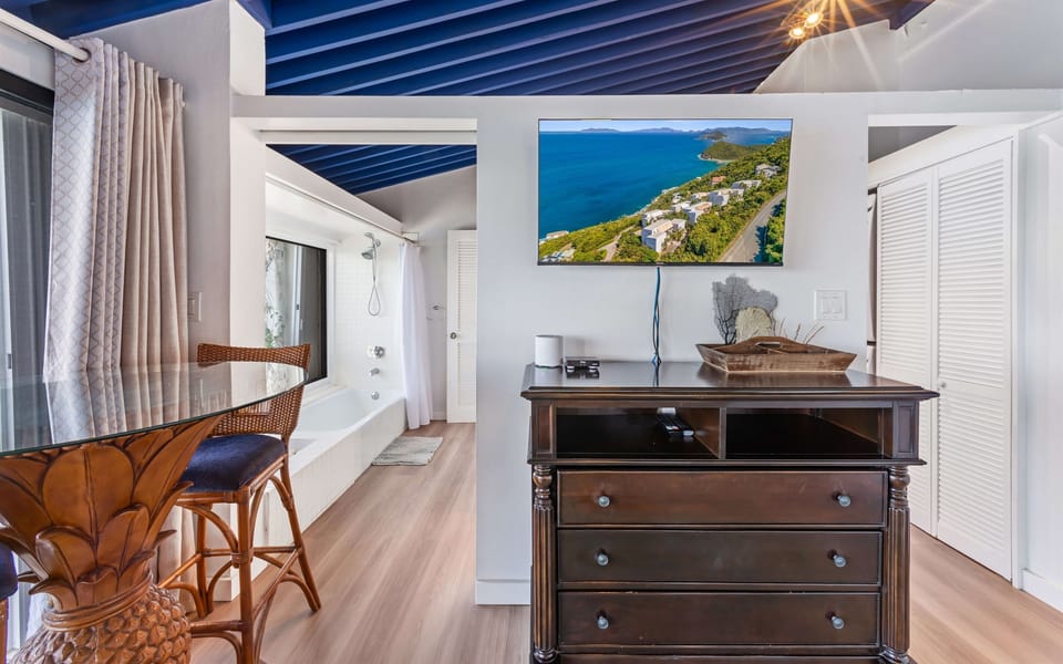 Ensuite primary bathroom; Spa-inspired ensuite with modern fixtures and ocean views from the shower.