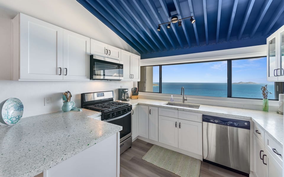 A fully equipped kitchen with, modern appliances, and dreamy views; cooking just got an upgrade.
