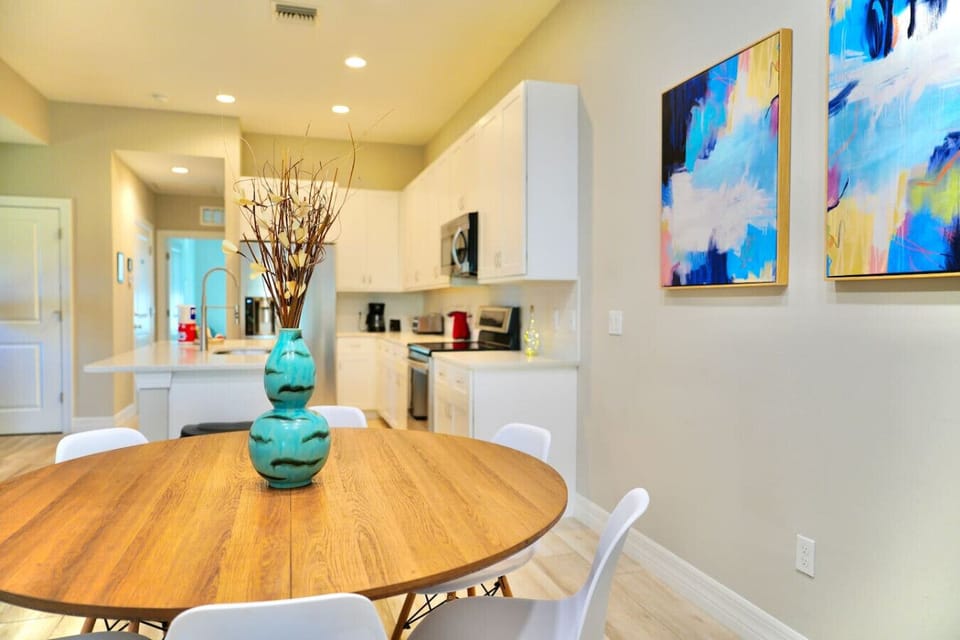 The kitchen and dining area are integrated into the living room to enjoy a nice family dinner while visiting SWFL!