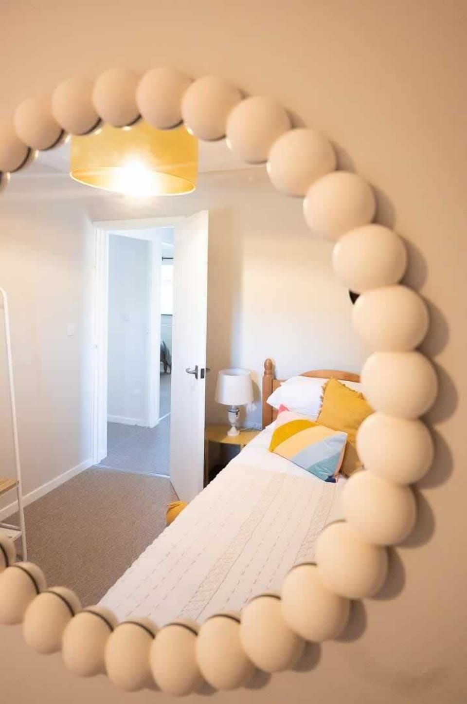 A refined mirror, enhancing the room with its elegant design and reflecting both light and style for a touch of sophistication.