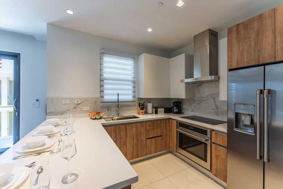 A bright, modern kitchen with everything set up for easy meals—perfect for cooking, sharing, and enjoying time together.