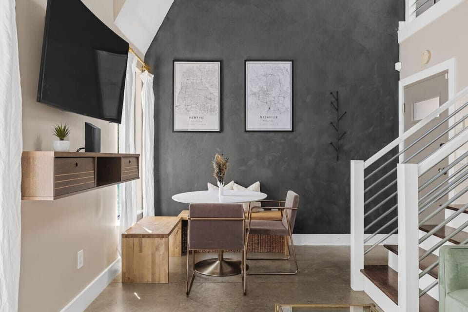 Dining nook with two chairs and two benches for ample seating.