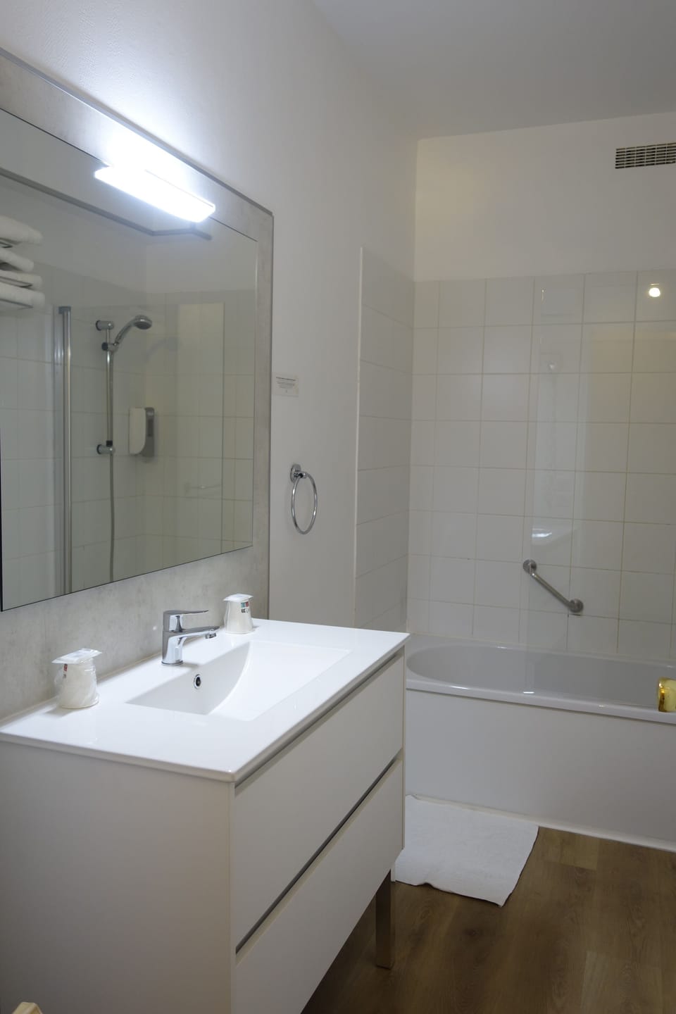 Bathtub, hair dryer, towels, soap