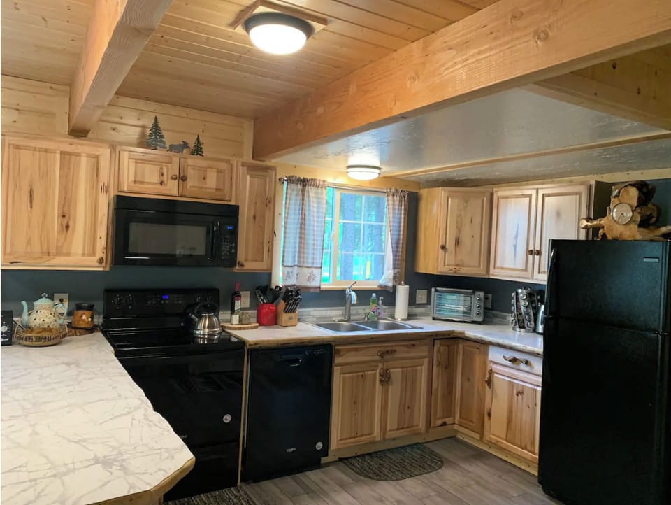 Spacious kitchen with ample counters and home-style amenities for easy cooking.