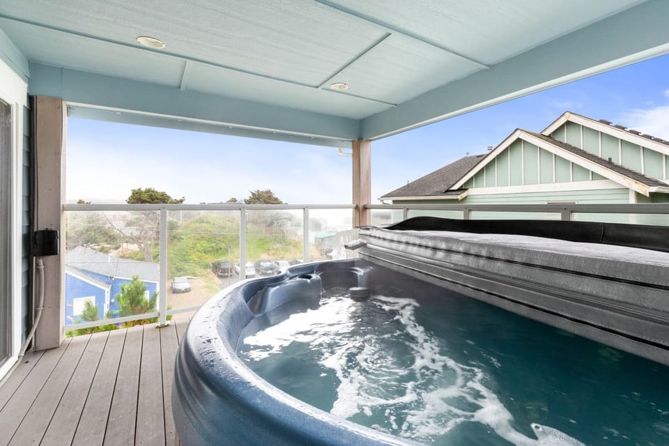 Private hot tub on the covered upper balcony, steps from the king suite