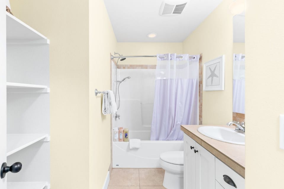 Shared full bath upstairs — tub and shower