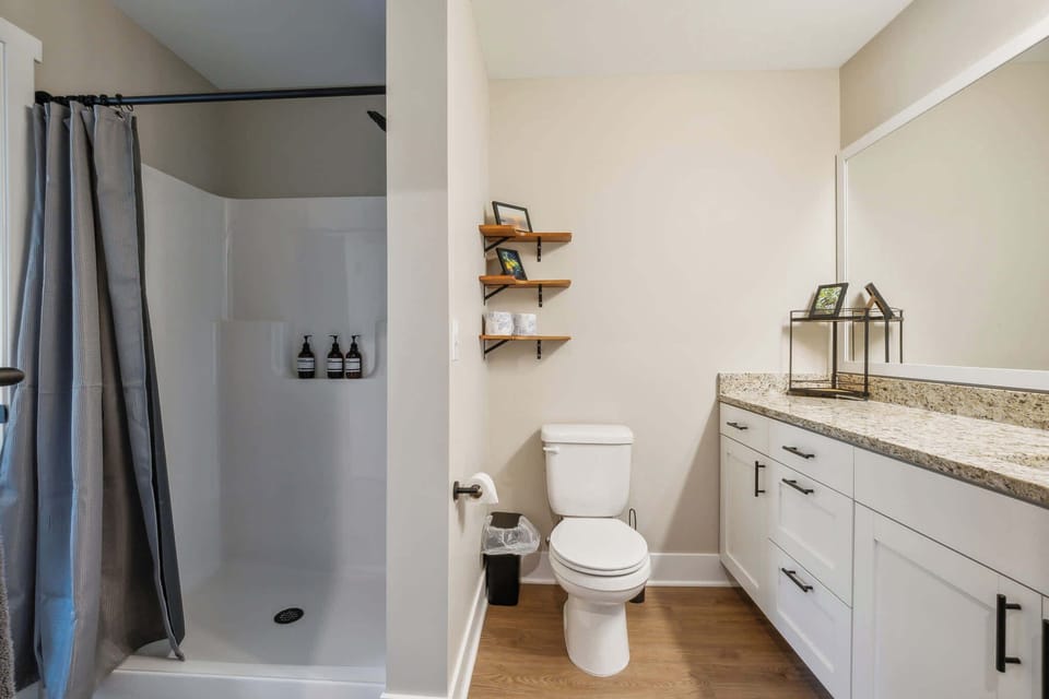 A Walk-in shower with plenty of space, with a connected walk-in closet