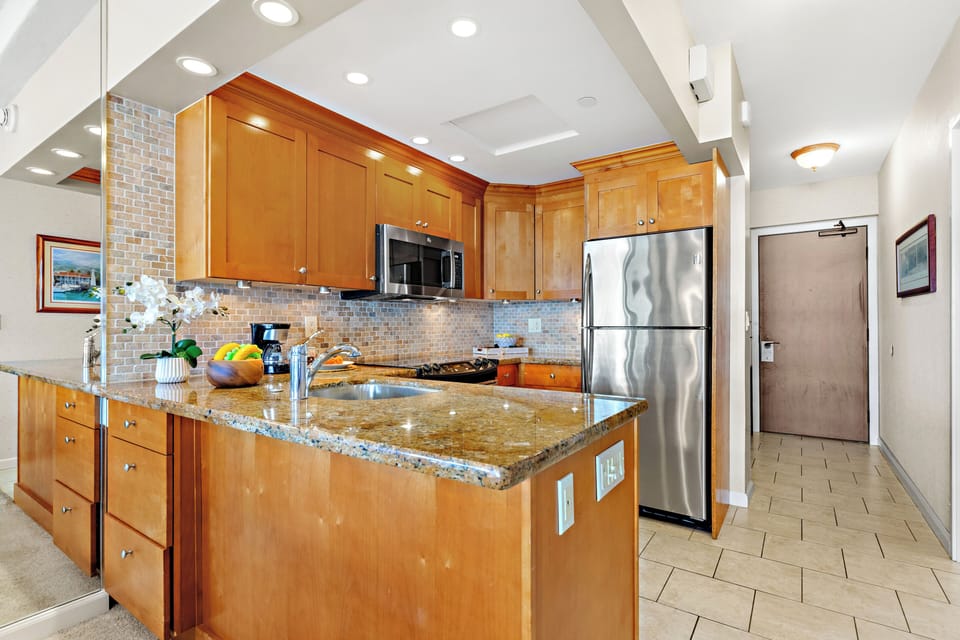 Cook with ease in a thoughtfully designed, fully equipped kitchen. Featuring modern appliances, ample counter space, and all the essentials you need, from quick island breakfasts to full home-cooked dinners.