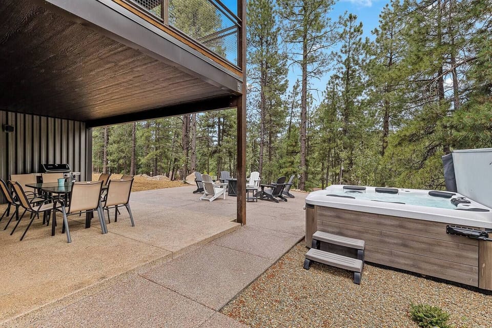 outdoor seating area with hot tub