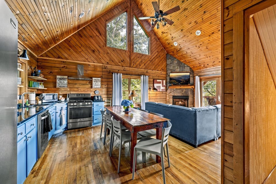 This is the view when you walk in the front door. The kitchen is stocked with all of the cooking supplies that you need to cook meals for your family, just bring food! 