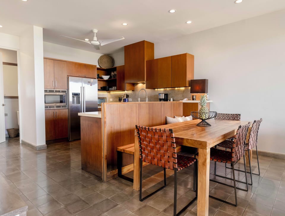 Dining table has seating for six adults