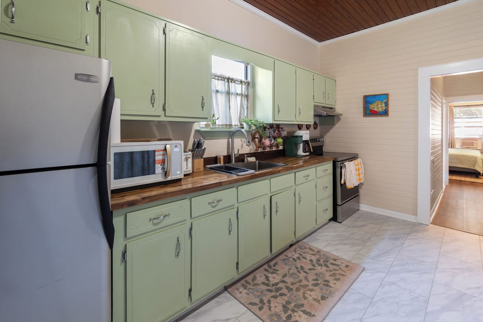 Fully stocked kitchen. Microwave, oven, stove, coffee maker, toaster and more.