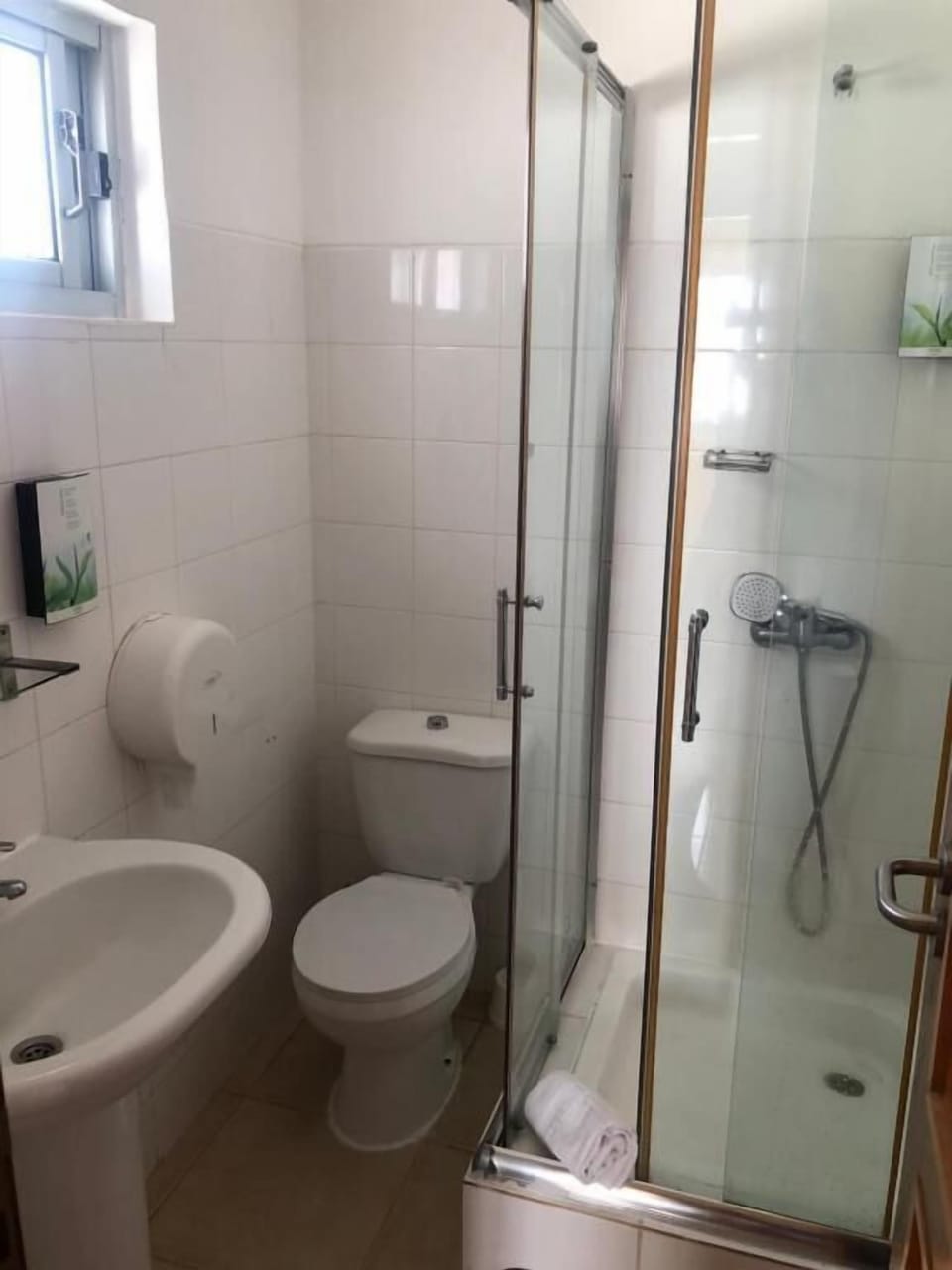 Shower, towels, shampoo, toilet paper