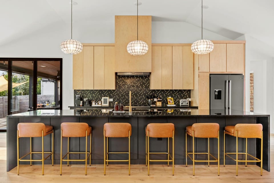 Fully stocked kitchen, breakfast bar with seating for 6 people.