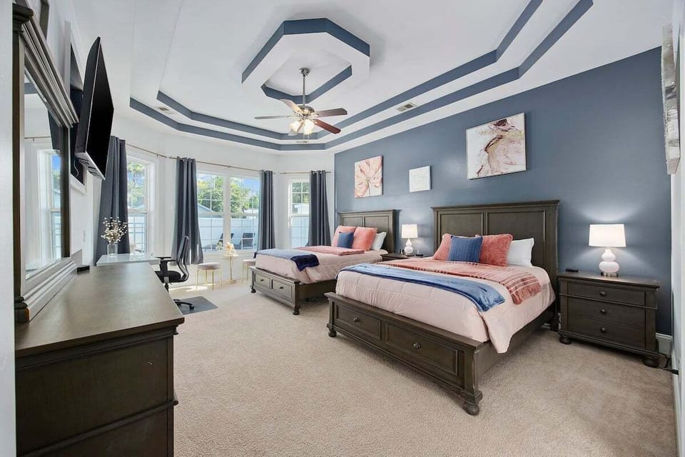 Perfect for groups or families, featuring two inviting queen beds and ample space to unwind.