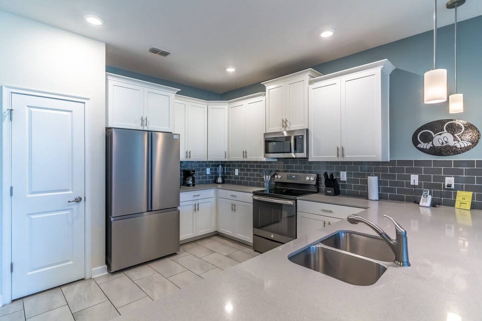 Open and modern fully stocked kitchen with stainless steel appliances and every feel of home!