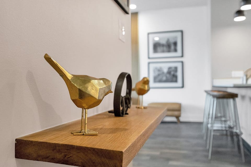 Whimsical gold accents add a playful touch to the decor.