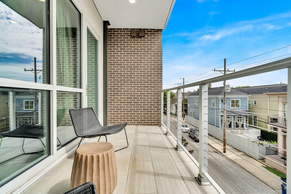 Private balcony w/ seating — your own quiet escape above the neighborhood.
