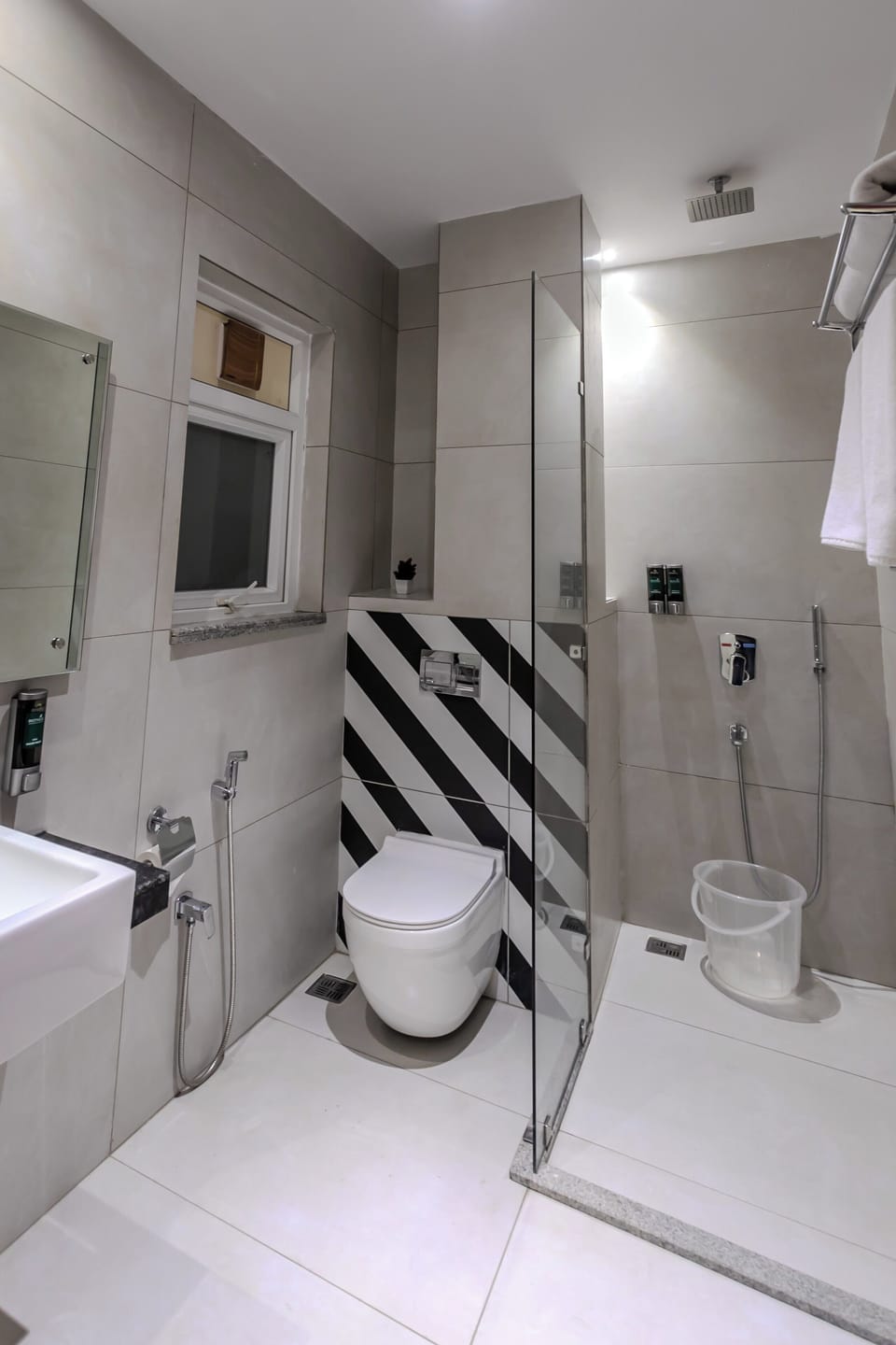 Shower, hair dryer, towels, toilet paper