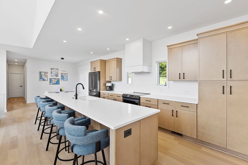 From morning coffee to dinner prep, this open-concept layout keeps everyone connected, with plenty of space to cook, chat, and unwind together. 