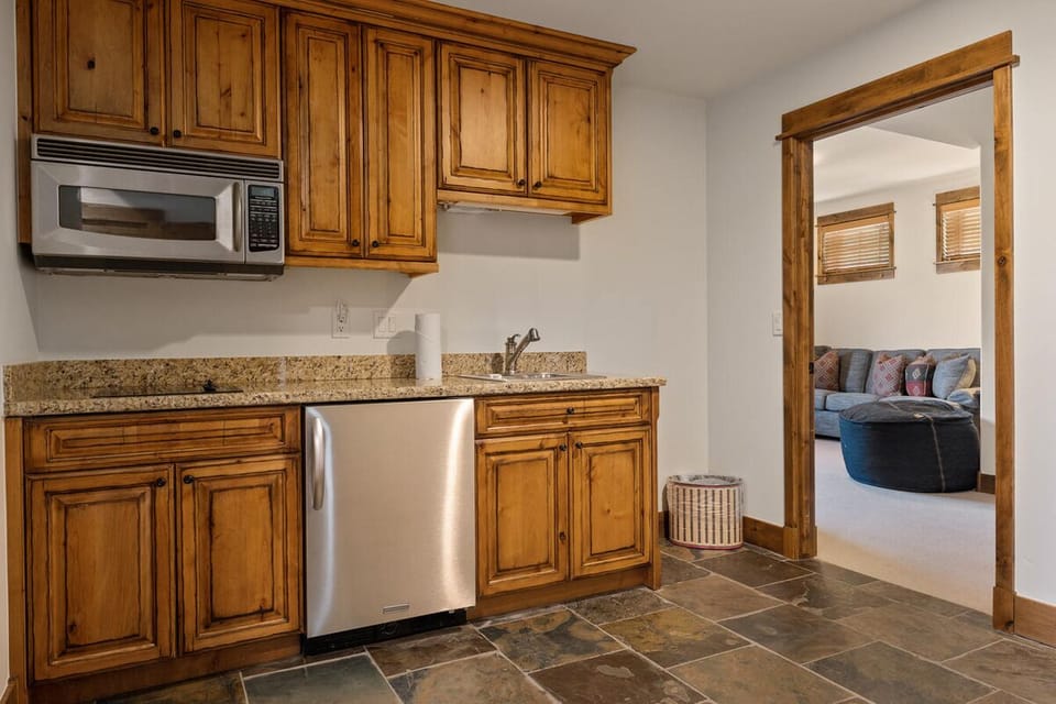 Refresh drinks and snacks easily from your handy wet bar.