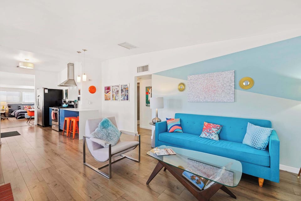 Bright living area with comfy seating and Smart TV