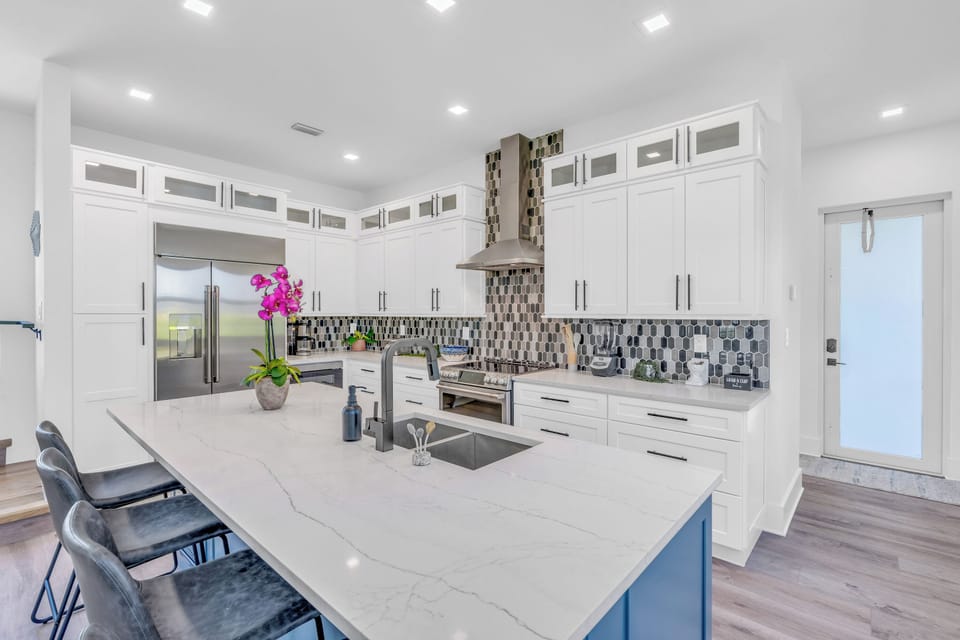 Gourmet kitchen with island seating—perfect for family meals and memories