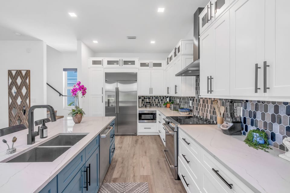 Chef’s kitchen with quartz counters, premium appliances, and island seating
