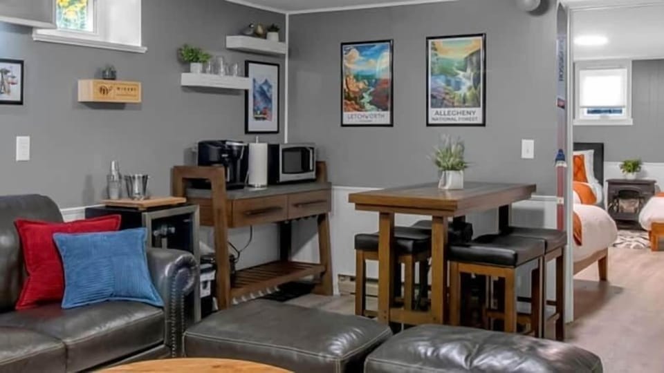 Kitchenette with mini fridge, coffee station, and seating for games and gathering.