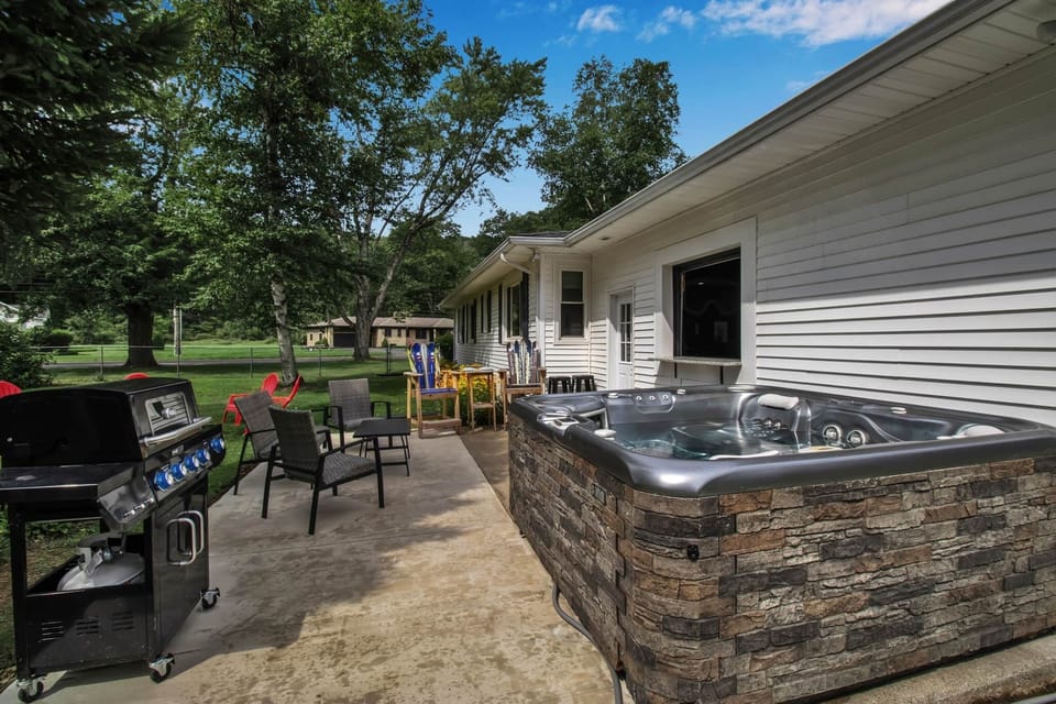Daytime view of the private hot tub and patio entertaining space.