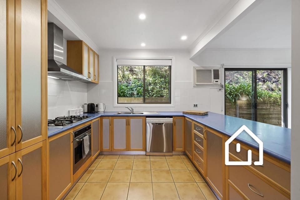 Well-equipped kitchen with Delonghi coffee pod machine